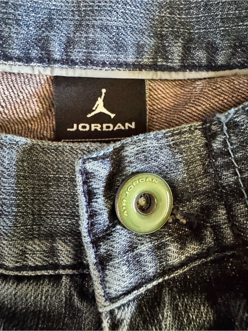 Jordan dark blue denim jeans with silver button